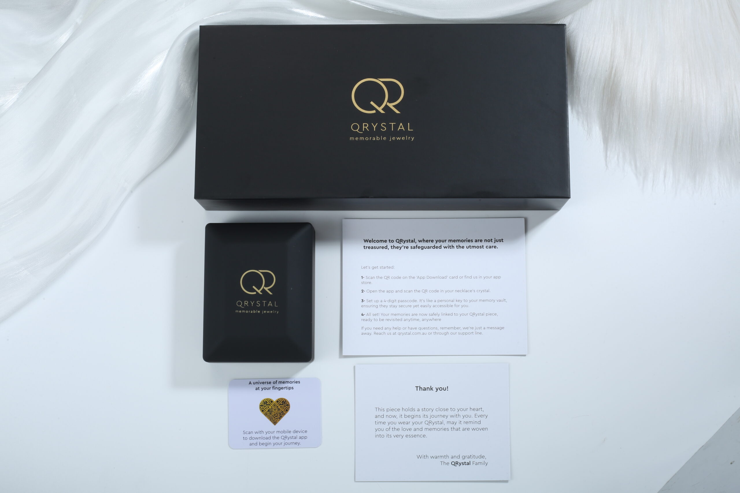 QRystal luxury packaging unboxing with app card, welcome guide and thank you note