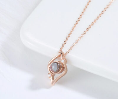 MemoryShell rose gold necklace featuring protective oval smoky quartz pendant
