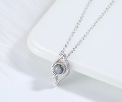 MemoryShell silver necklace featuring protective oval smoky quartz pendant